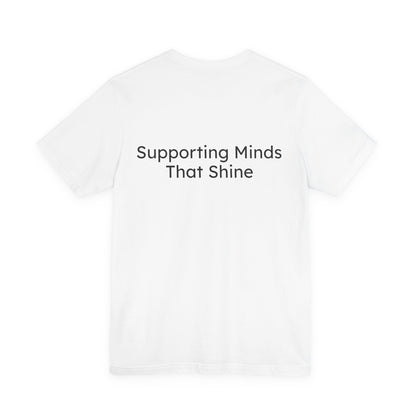 White t-shirt with 'Supporting Minds That Shine' text on a white background