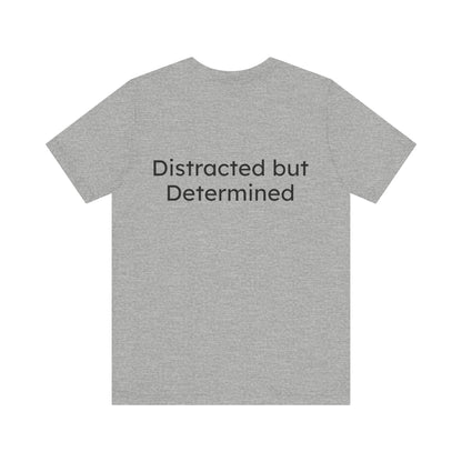 Gray t-shirt with 'Distracted but Determined' text on a white background