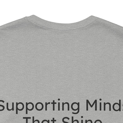Gray t-shirt with text 'Supporting Minds That Shine' on a white background