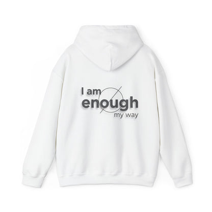 White hoodie with 'I am enough my way' text on the back against a white background
