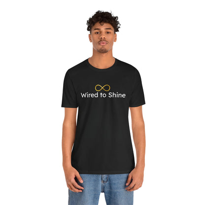 Person wearing a black t-shirt with 'Wired to Shine' text and infinity symbol on a white background
