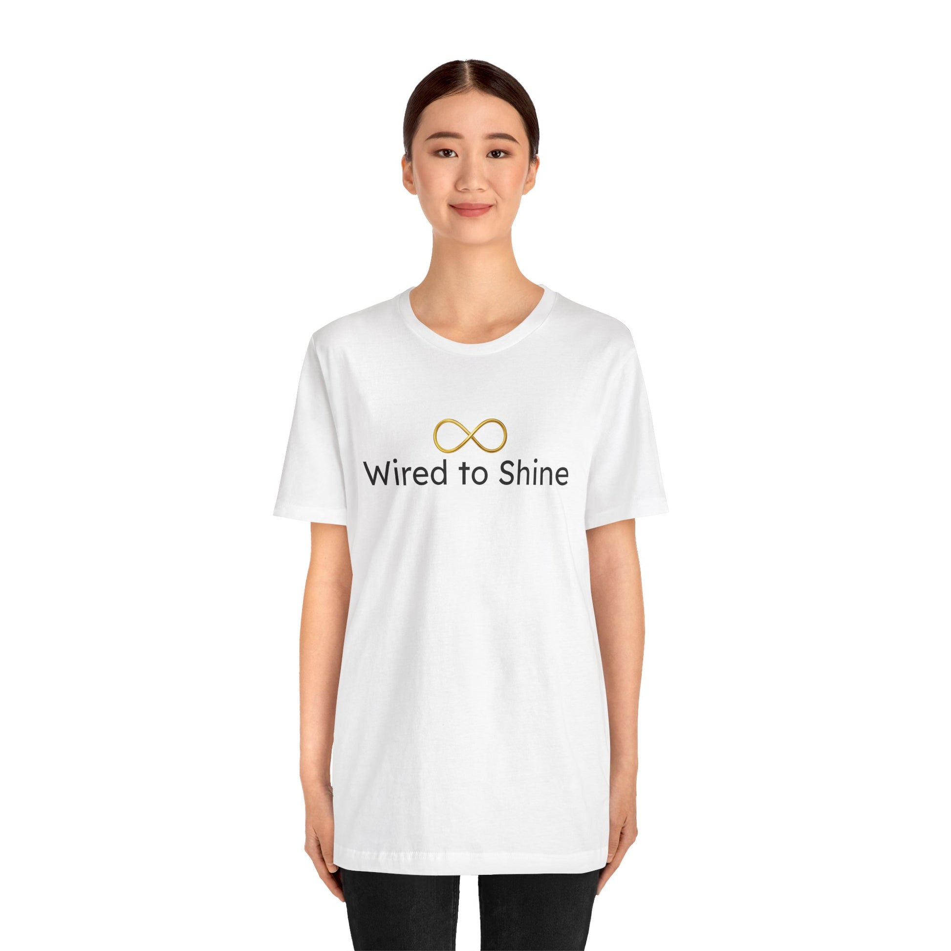 Person wearing a white t-shirt with 'Wired to Shine' text and logo on a white background