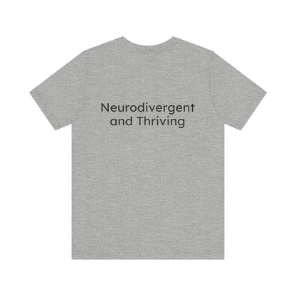 Gray t-shirt with 'Neurodivergent and Thriving' text on a white background