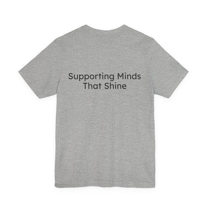 Gray t-shirt with 'Supporting Minds That Shine' text on the back against a white background