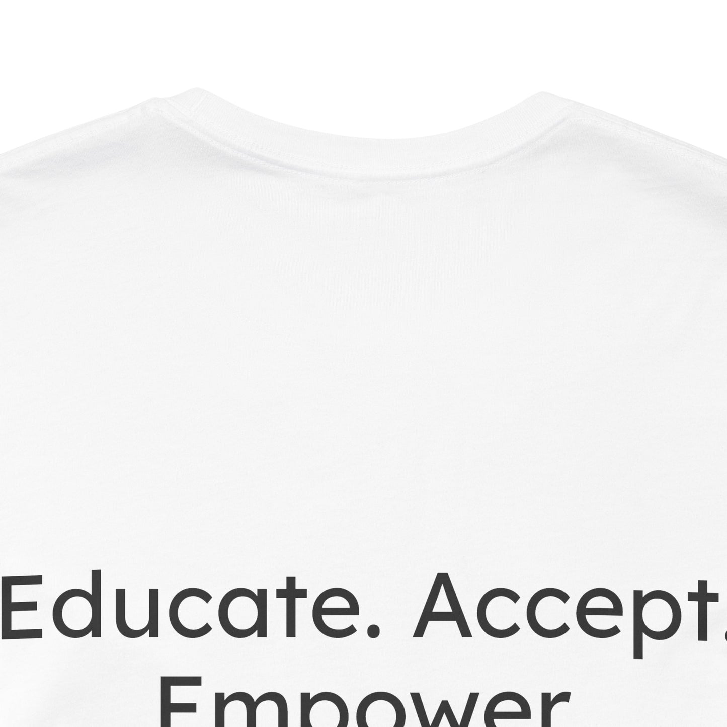 White t-shirt with motivational text 'Educate. Accept. Empower' on a white background