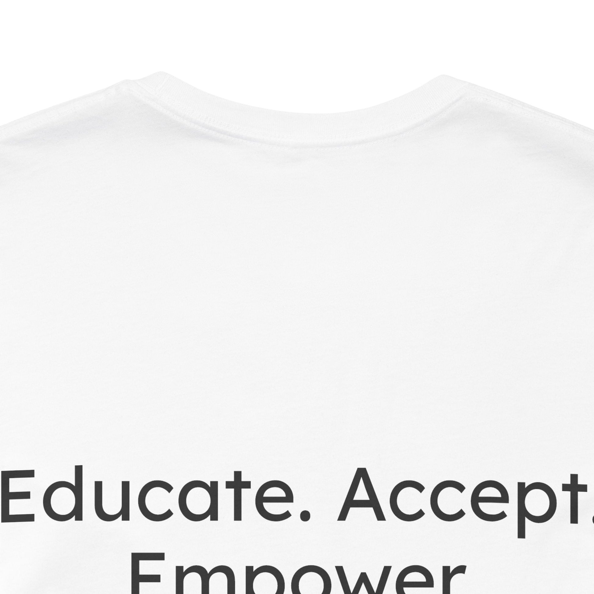 White t-shirt with motivational text 'Educate. Accept. Empower' on a white background