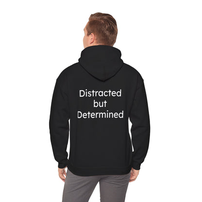 Black hoodie with 'Distracted but Determined' text on the back, worn by a person.