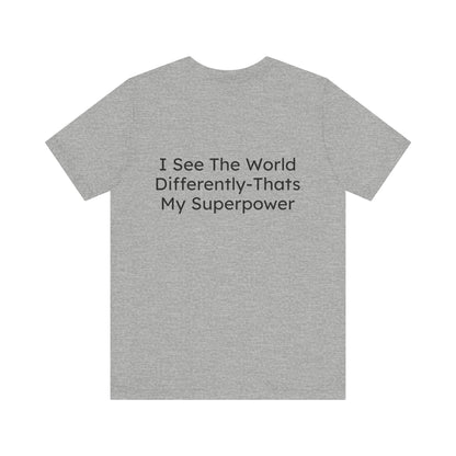 Gray t-shirt with text 'I See The World Differently-That's My Superpower' on a white background