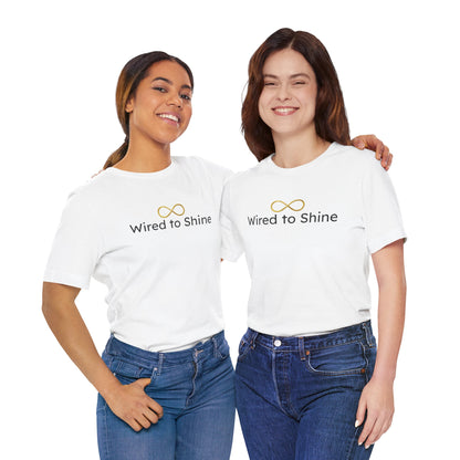 Two women wearing white t-shirts with 'Wired to Shine' text and infinity symbol on a white background.
