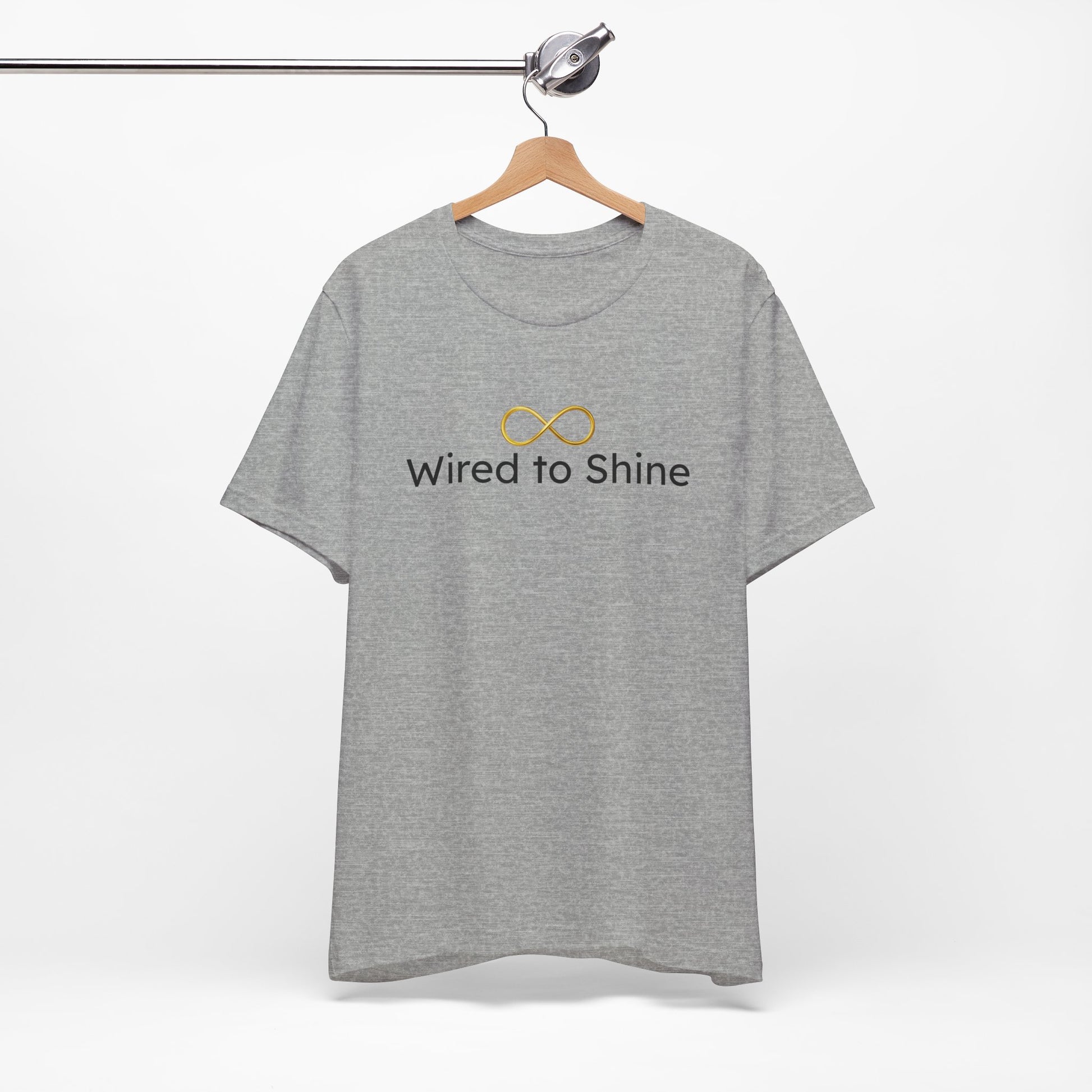 Gray t-shirt with 'Wired to Shine' text and logo on a hanger against a white background