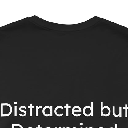 Black t-shirt with white text 'Distracted but Determined' on a white background