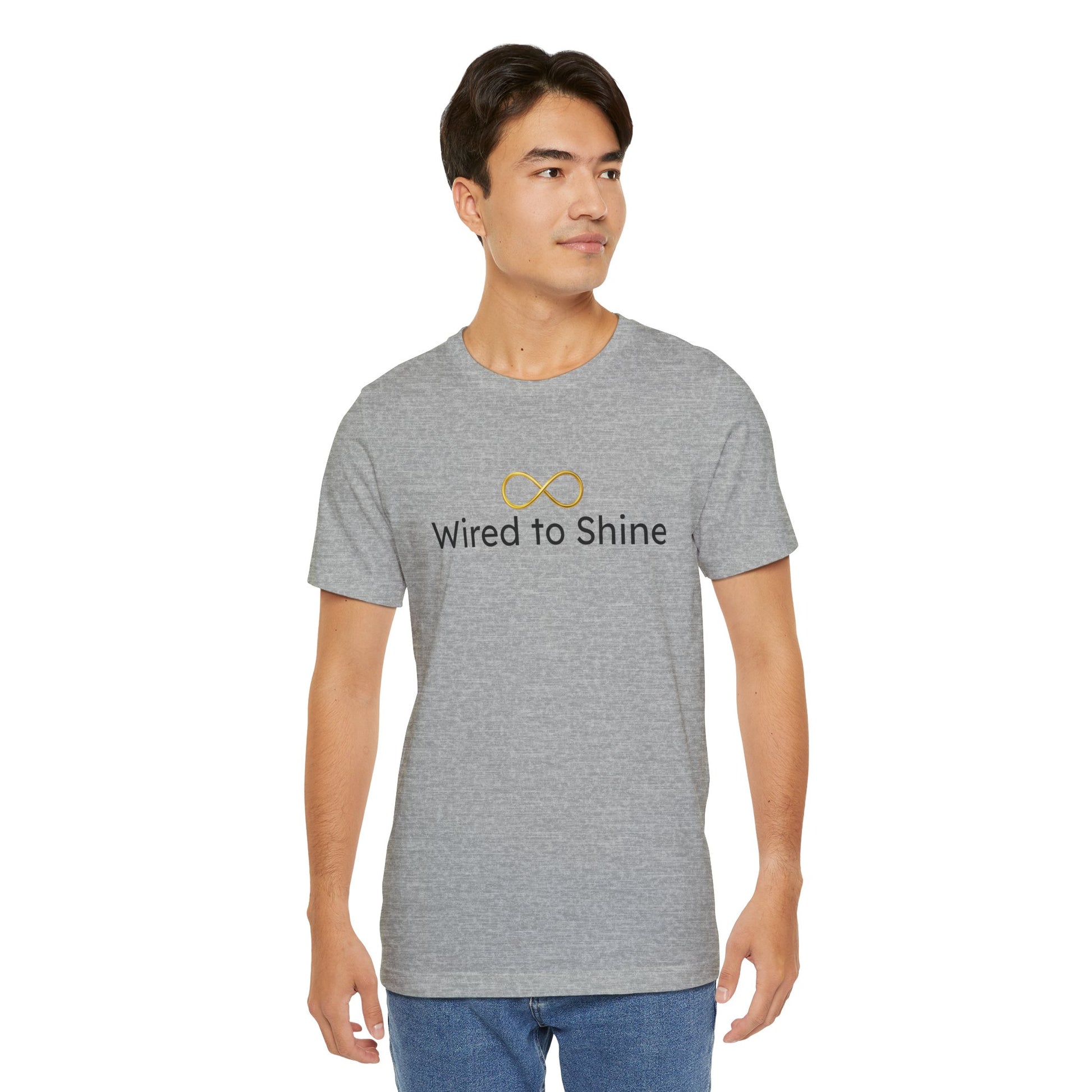 Man wearing a gray t-shirt with 'Wired to Shine' text and logo on a white background
