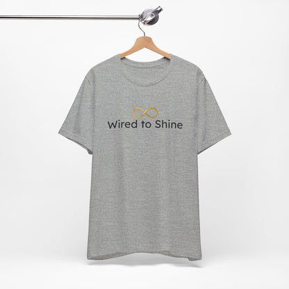 Gray t-shirt with 'Wired to Shine' text and logo on a hanger against a white background