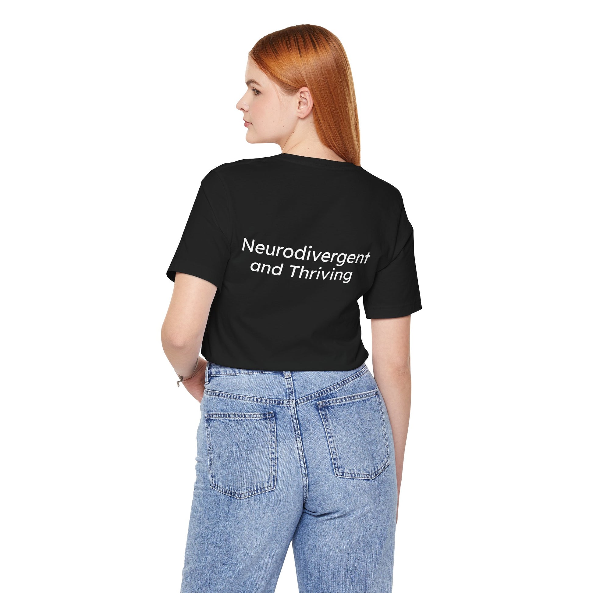 Person wearing a black t-shirt with 'Neurodivergent and Thriving' text on the back, standing against a white background.