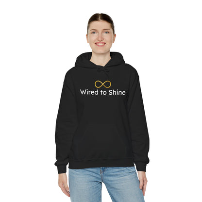Person wearing a black hoodie with 'Wired to Shine' text and logo on a white background