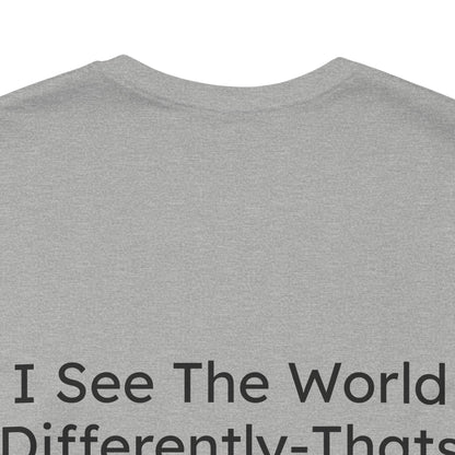 Gray t-shirt with text 'I See The World Differently-That's Fine' on a white background