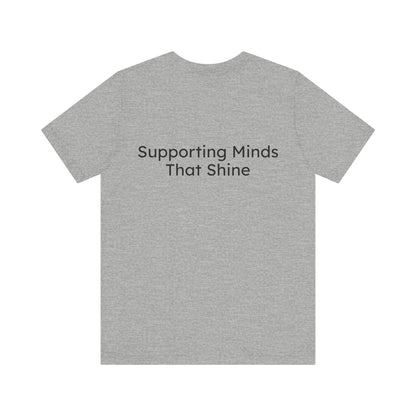 Gray t-shirt with 'Supporting Minds That Shine' text on a white background