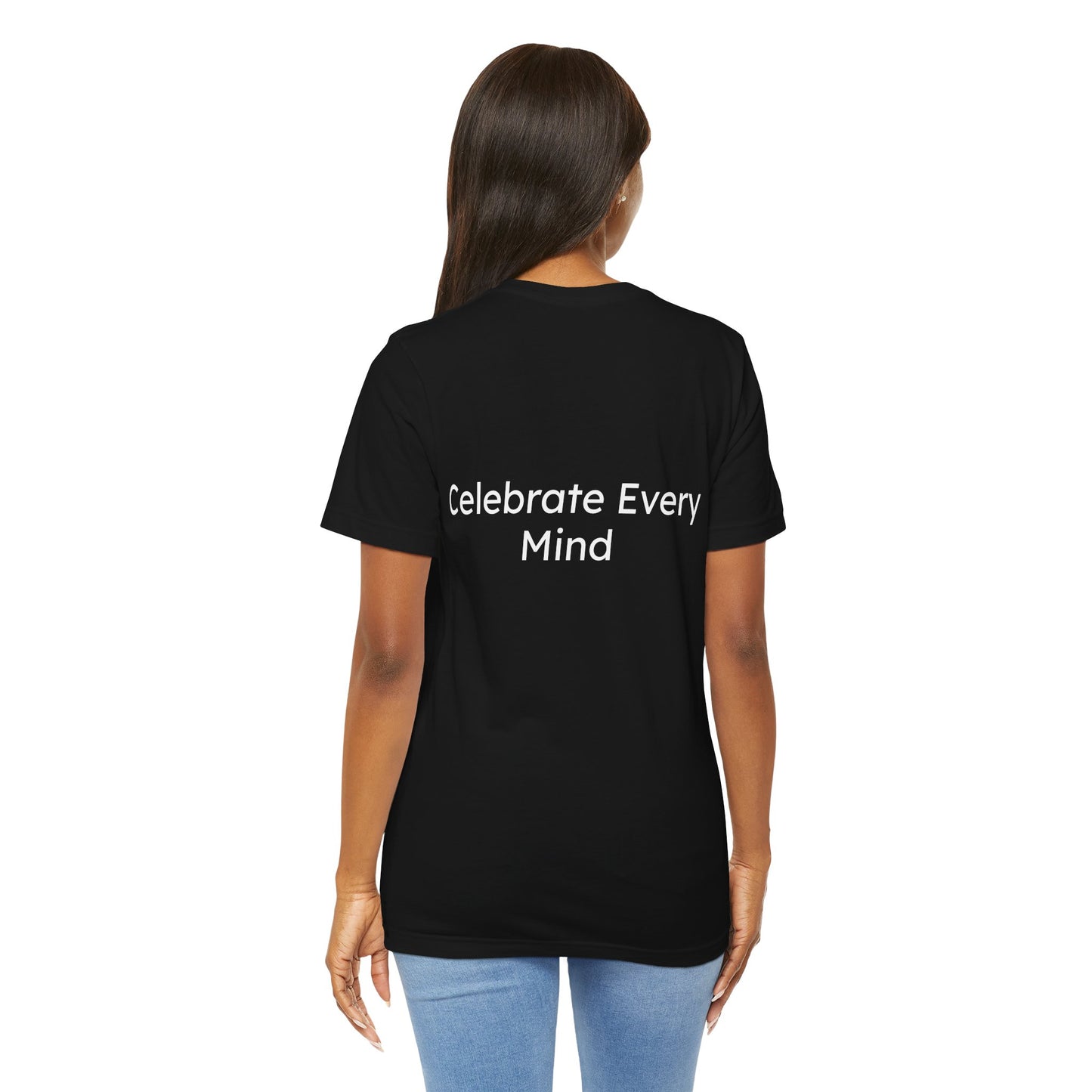 Person wearing a black t-shirt with 'Celebrate Every Mind' text on the back, standing against a white background.