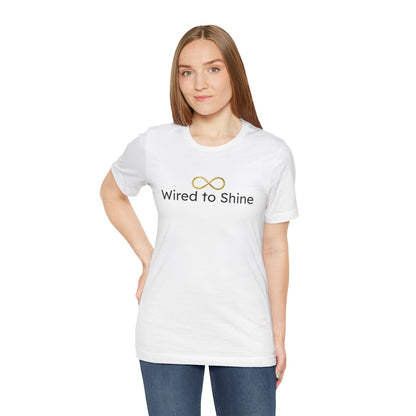 Woman wearing a white t-shirt with 'Wired to Shine' text and infinity symbol on a white background