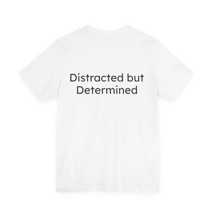 White t-shirt with 'Distracted but Determined' text on a white background