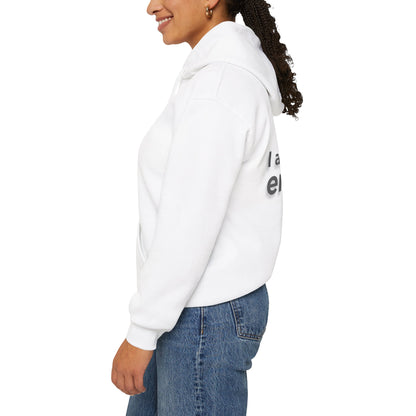 Person wearing a white hoodie with text on the back, standing against a white background