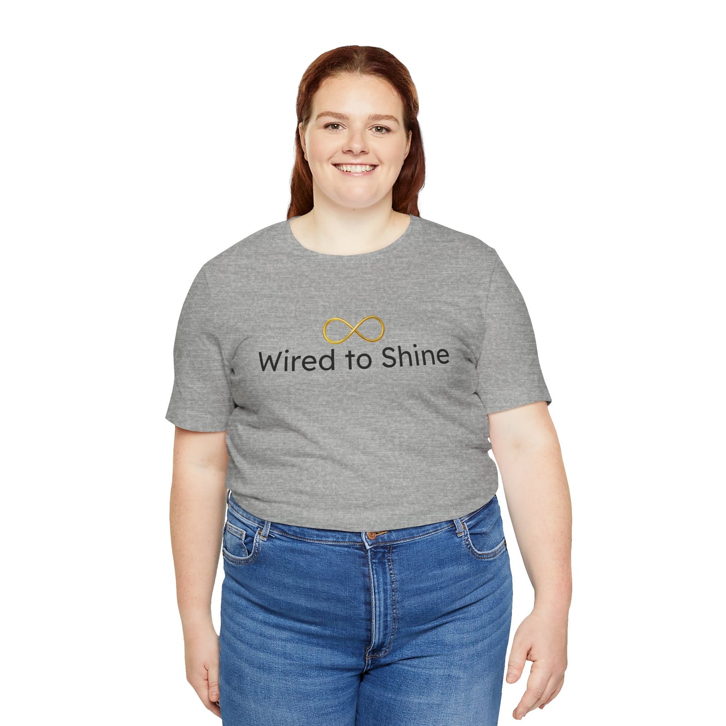 Person wearing a gray t-shirt with 'Wired to Shine' text and infinity symbol on a white background