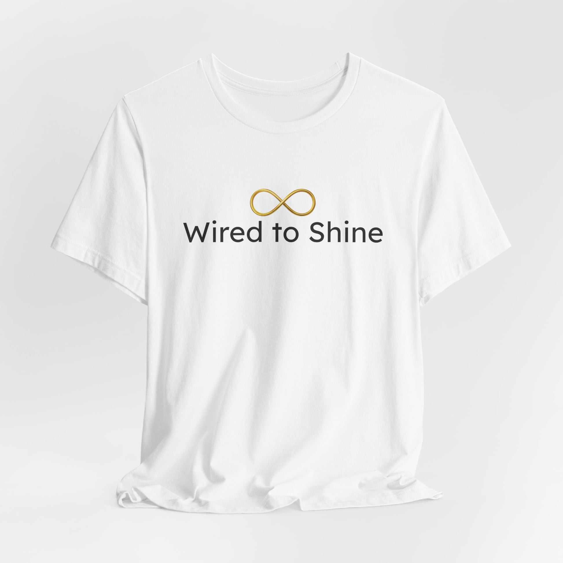 White t-shirt with 'Wired to Shine' text and logo on a light gray background