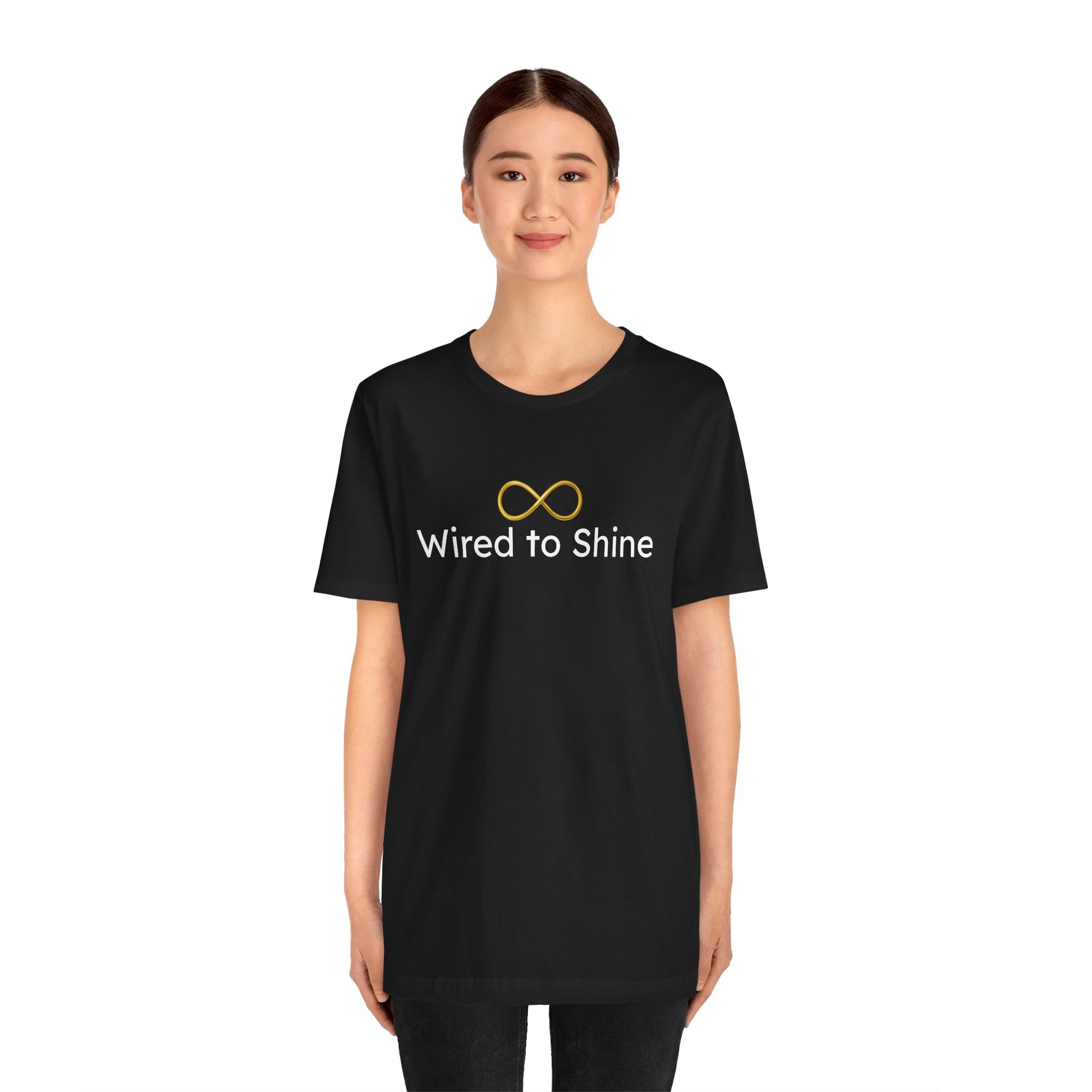 Person wearing a black t-shirt with 'Wired to Shine' logo on a white background