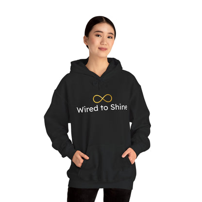 Person wearing a black hoodie with 'Wired to Shine' text and logo on a white background