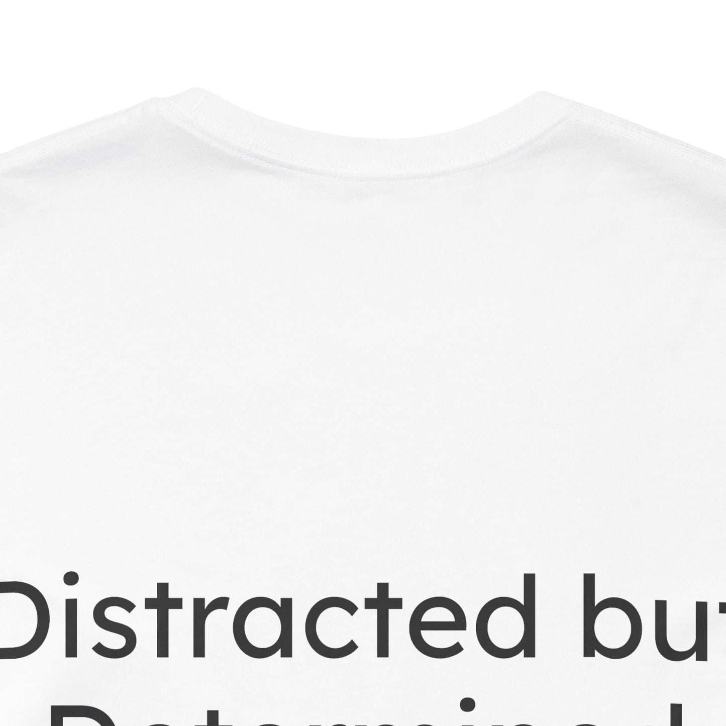 White t-shirt with black text 'Distracted but Determined' on a white background