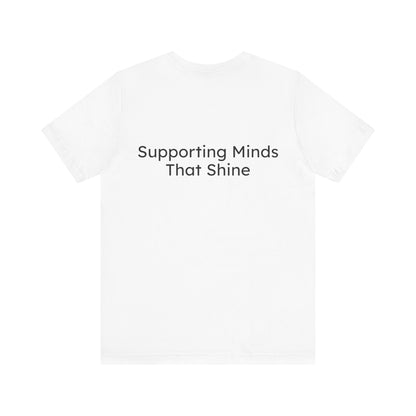 White t-shirt with 'Supporting Minds That Shine' text on a white background