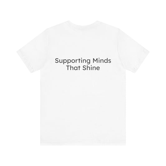 White t-shirt with 'Supporting Minds That Shine' text on a white background