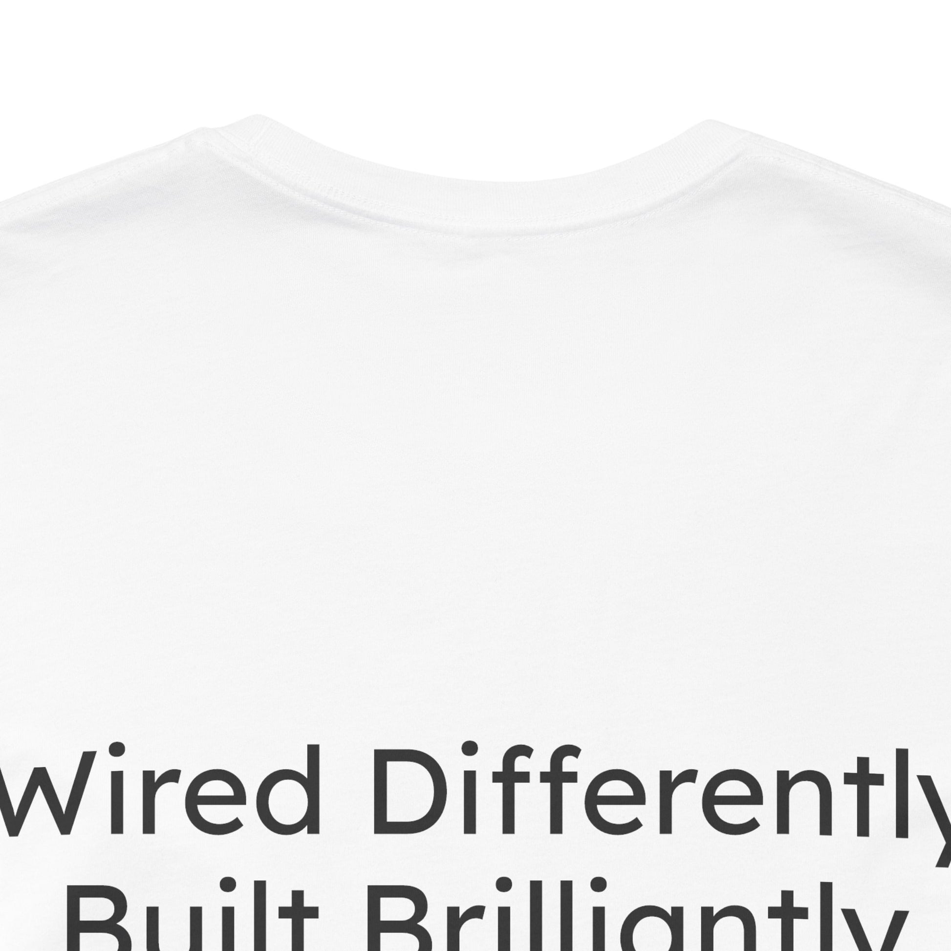 White t-shirt with text 'Wired Differently, Built Brilliantly' on a white background