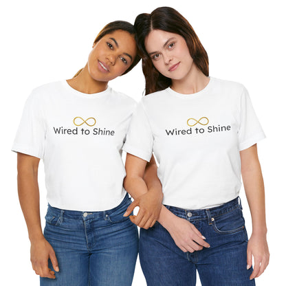 Two people wearing white t-shirts with 'Wired to Shine' text on a white background
