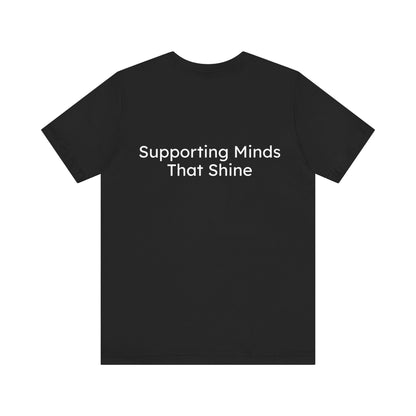 Black t-shirt with 'Supporting Minds That Shine' text on a white background