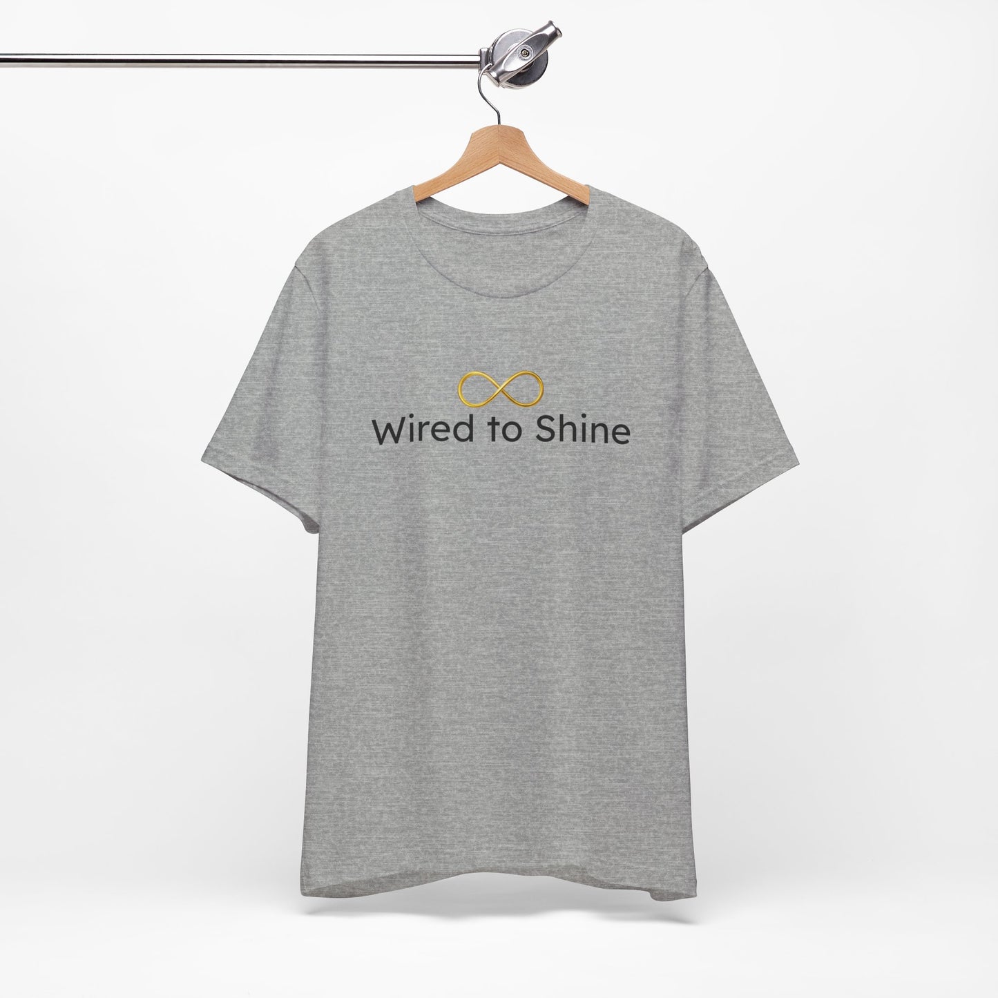 Gray t-shirt with 'Wired to Shine' text and logo on a hanger against a white background