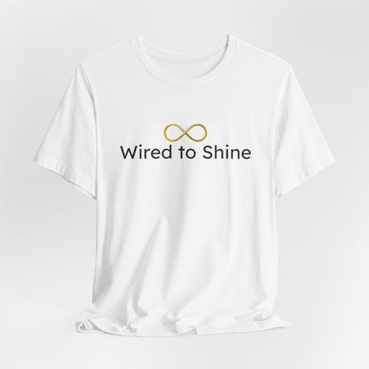 White t-shirt with 'Wired to Shine' text and logo on a light gray background