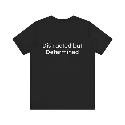 Black t-shirt with 'Distracted but Determined' text on the back against a white background