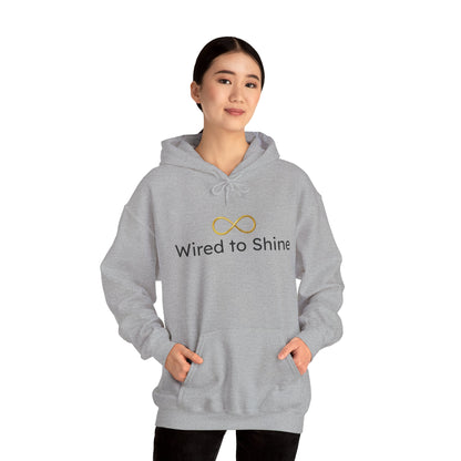 Person wearing a gray hoodie with 'Wired to Shine' text and logo on a white background
