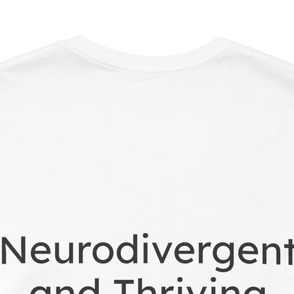 White t-shirt with black text 'Neurodivergent and Thriving' on a white background