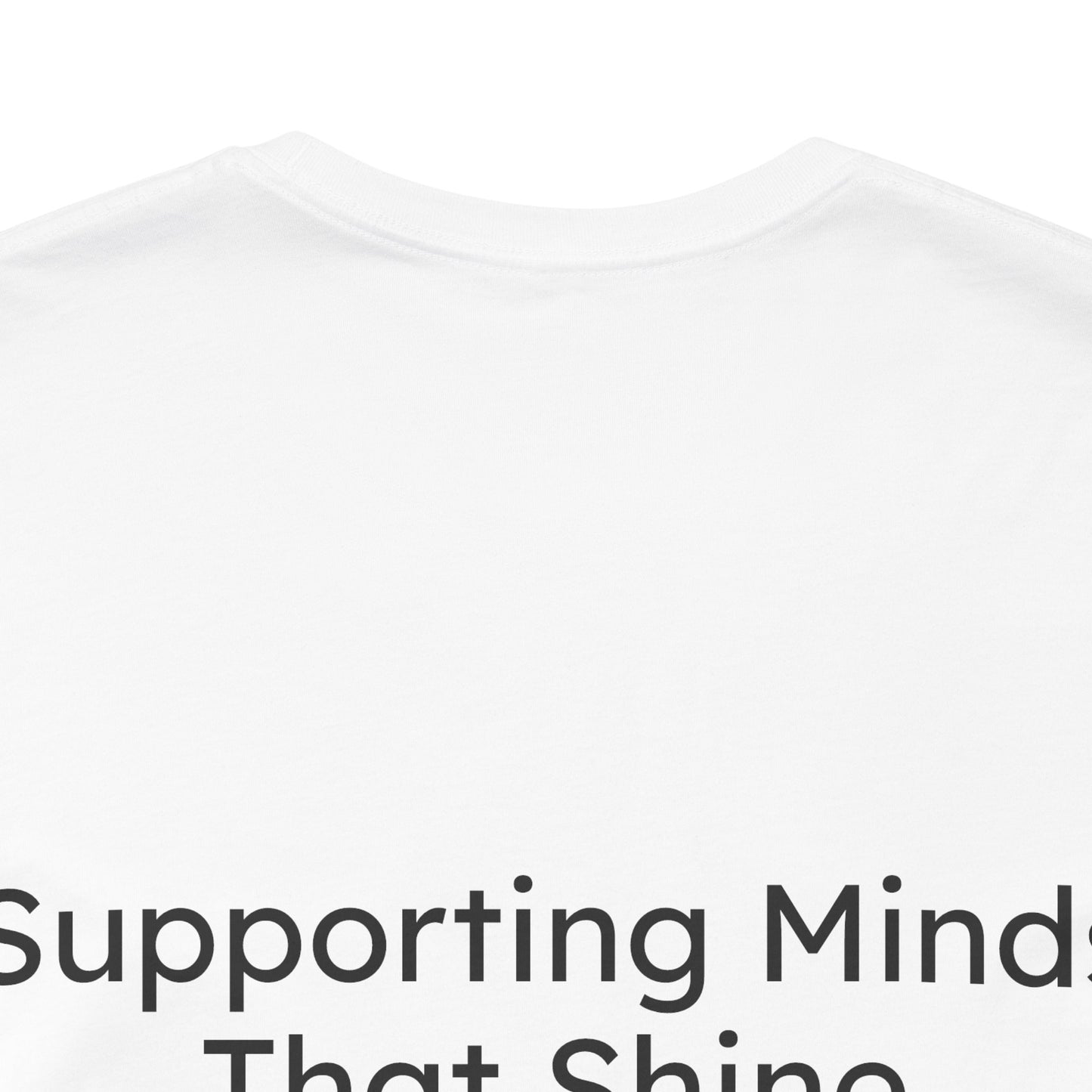 White t-shirt with text 'Supporting Minds That Shine' on a white background