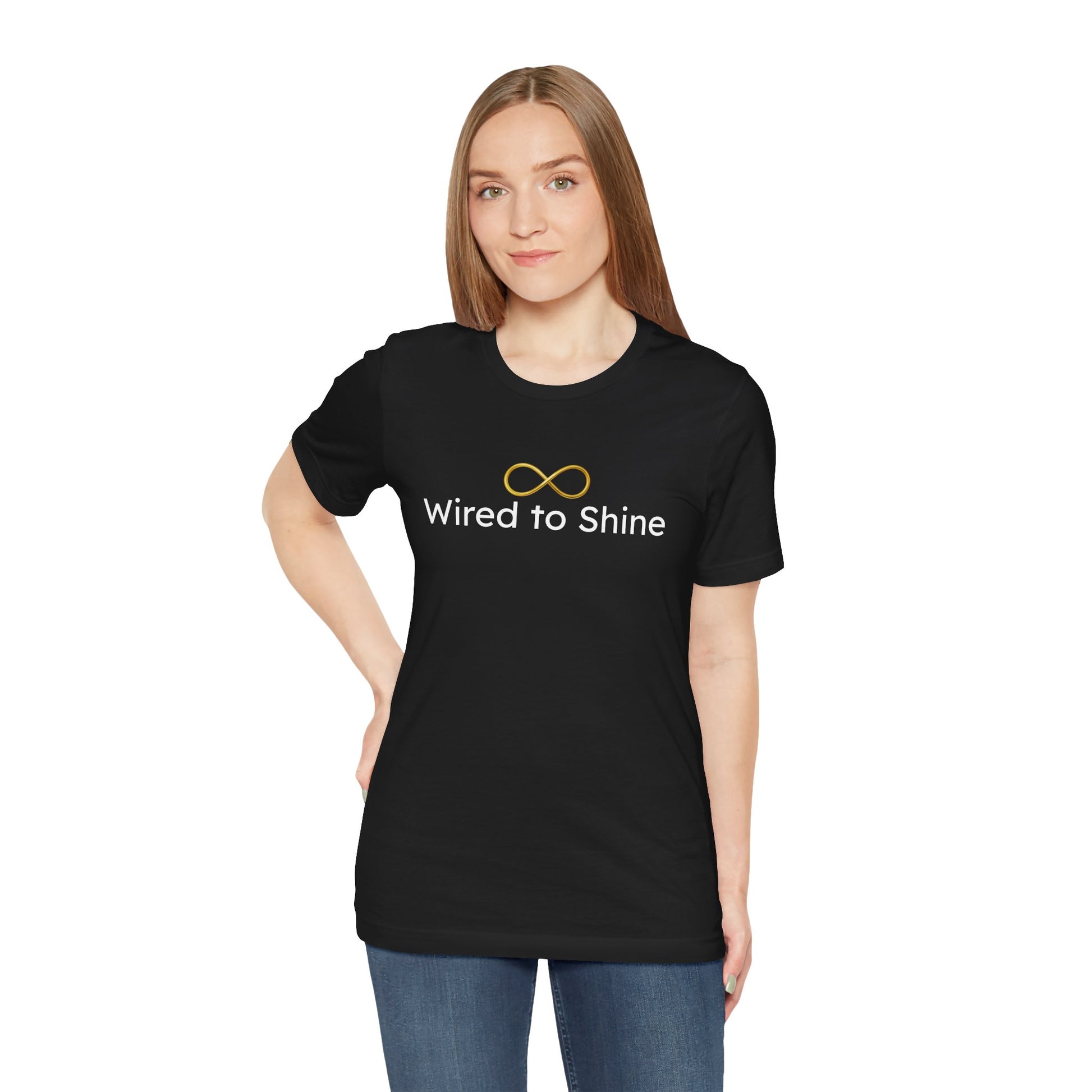 Person wearing a black t-shirt with 'Wired to Shine' text and design on a white background
