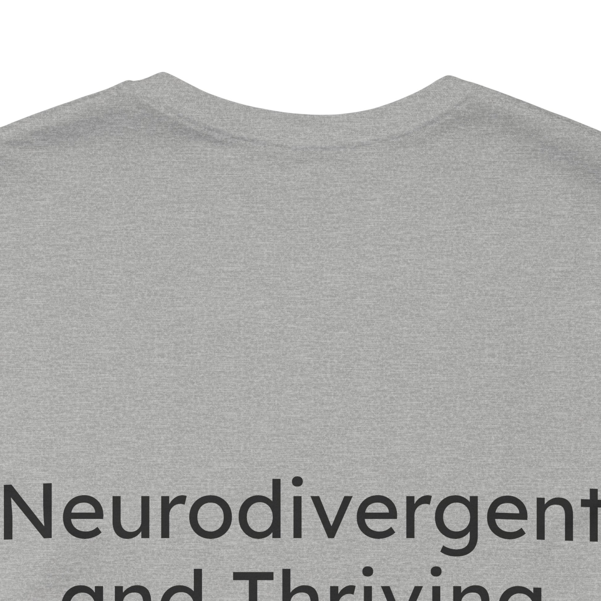 Gray t-shirt with 'Neurodivergent and Thriving' text on a white background