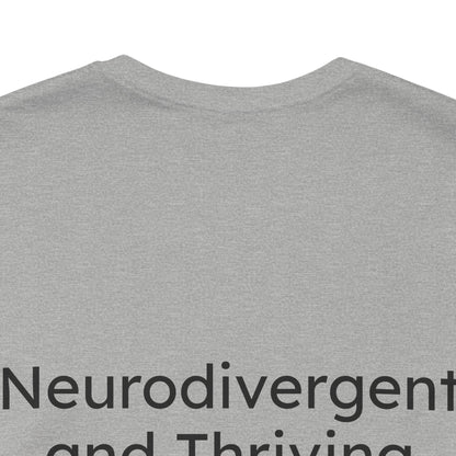 Gray t-shirt with 'Neurodivergent and Thriving' text on a white background
