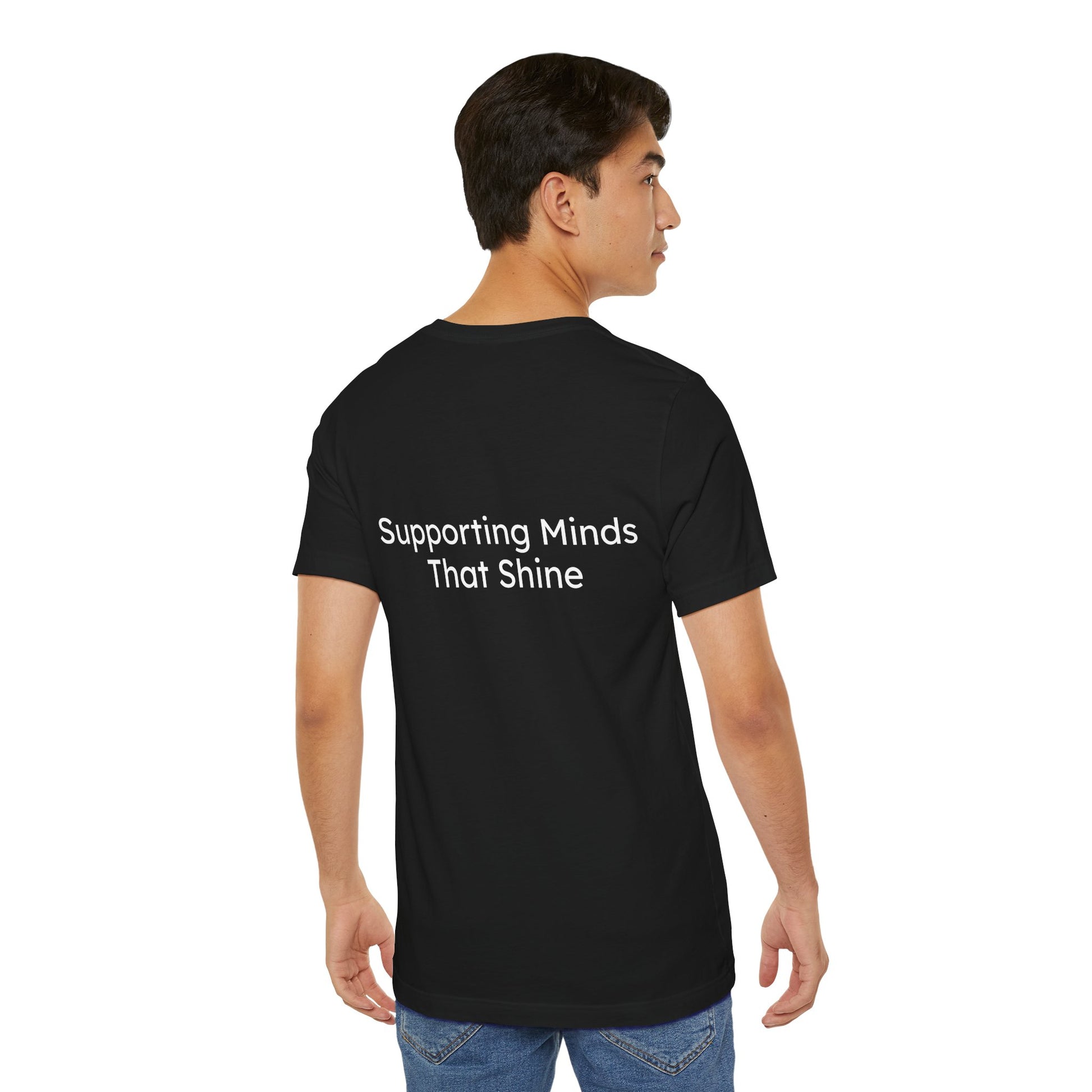 Person wearing a black t-shirt with 'Supporting Minds That Shine' text on the back.
