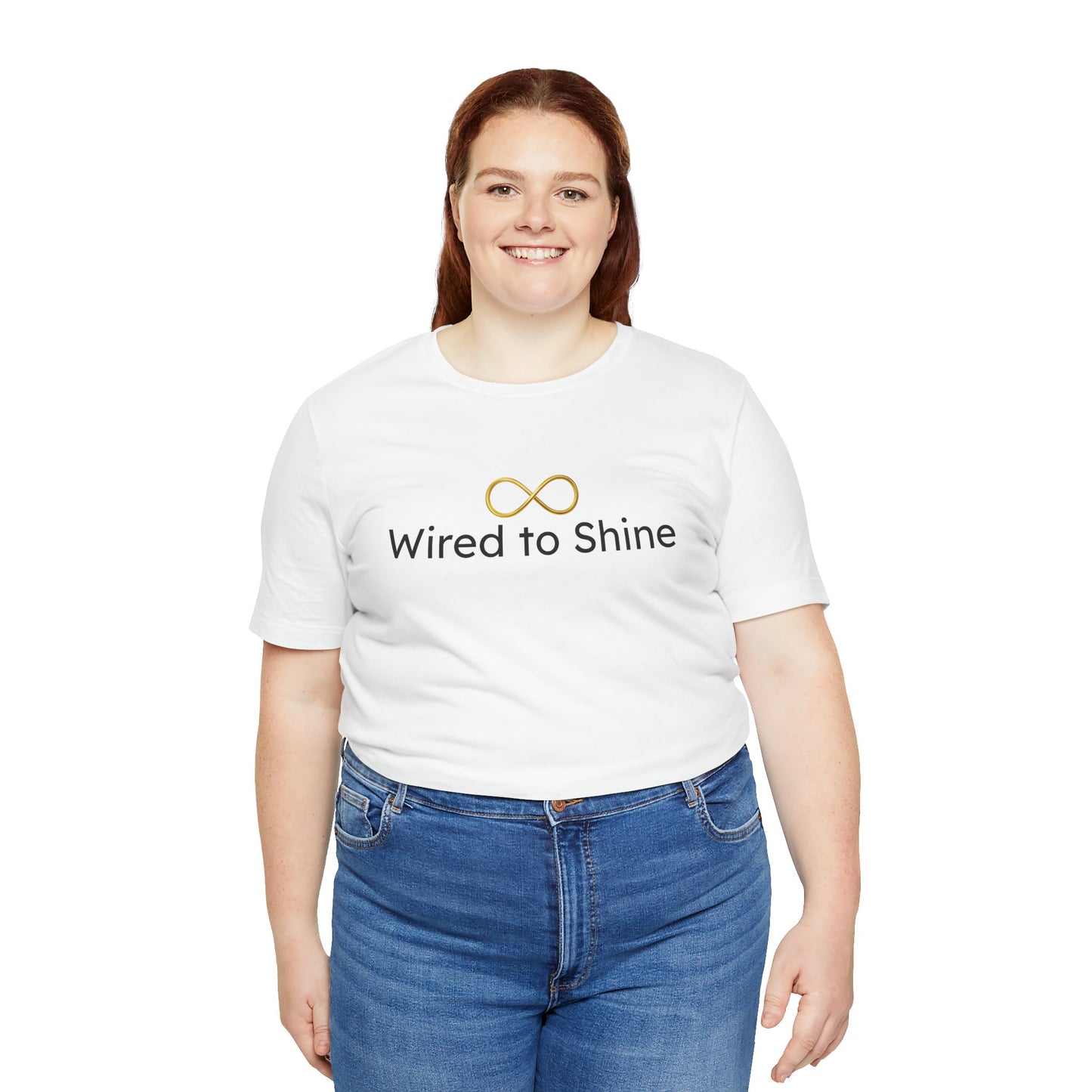 Person wearing a white t-shirt with 'Wired to Shine' text and blue jeans on a white background